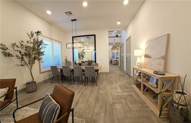 dining room with a chandelier, visible vents, recessed lighting, and baseboards