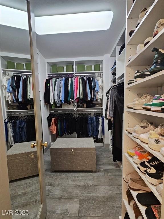 spacious closet with wood finished floors