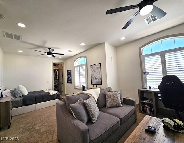 living room featuring recessed lighting, visible vents, and a ceiling fan