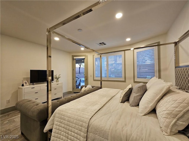 bedroom featuring visible vents, baseboards, recessed lighting, wood finished floors, and access to outside