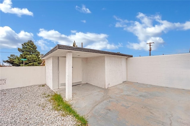 view of outbuilding with fence