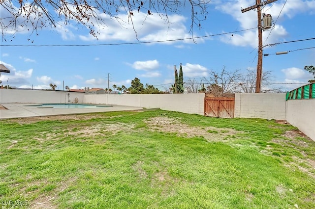 view of yard with a fenced in pool and a fenced backyard