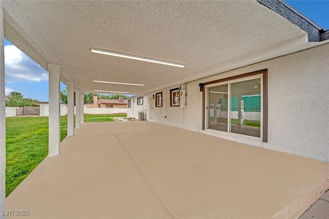 view of patio featuring fence