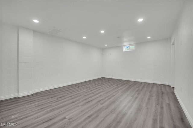 basement with recessed lighting, baseboards, and wood finished floors