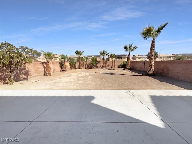 view of yard with a patio and a fenced backyard