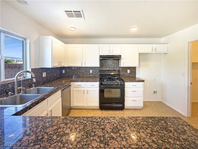 kitchen with black gas range oven, visible vents, a sink, under cabinet range hood, and stainless steel dishwasher