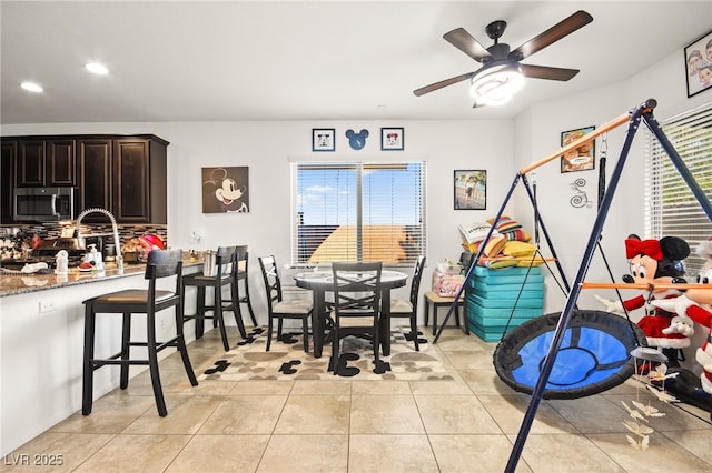 dining area featuring recessed lighting, light tile patterned flooring, and a ceiling fan