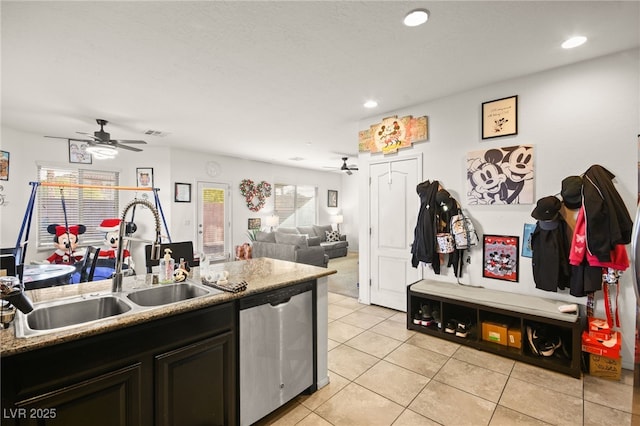 kitchen featuring light tile patterned floors, visible vents, recessed lighting, a sink, and dishwasher