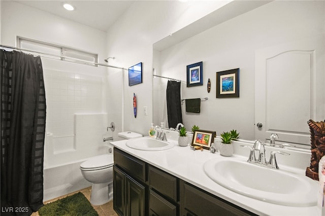 full bathroom with tile patterned flooring, toilet, shower / bath combo with shower curtain, and a sink