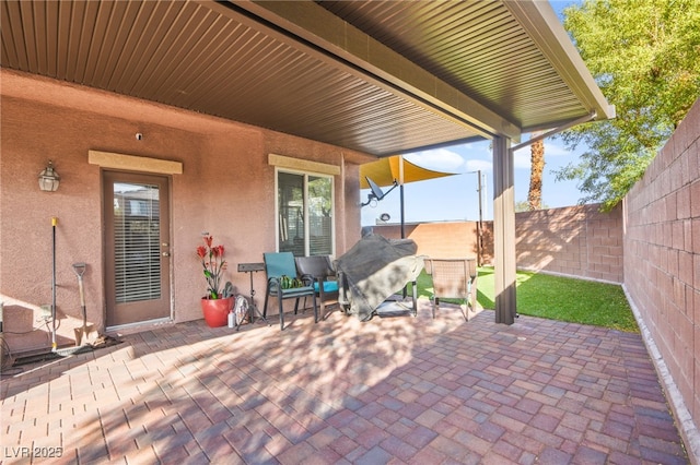 view of patio / terrace with a fenced backyard and grilling area