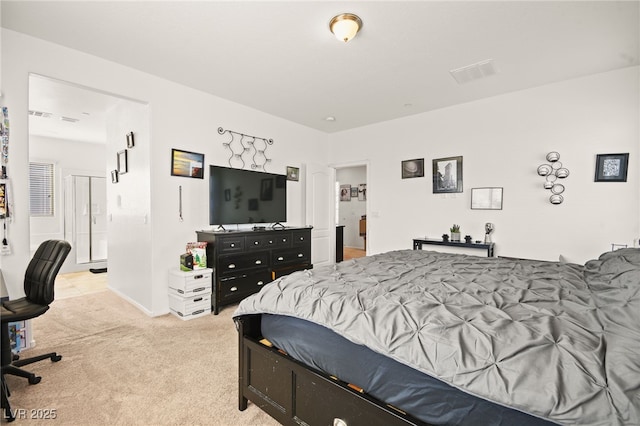 bedroom featuring visible vents and light carpet