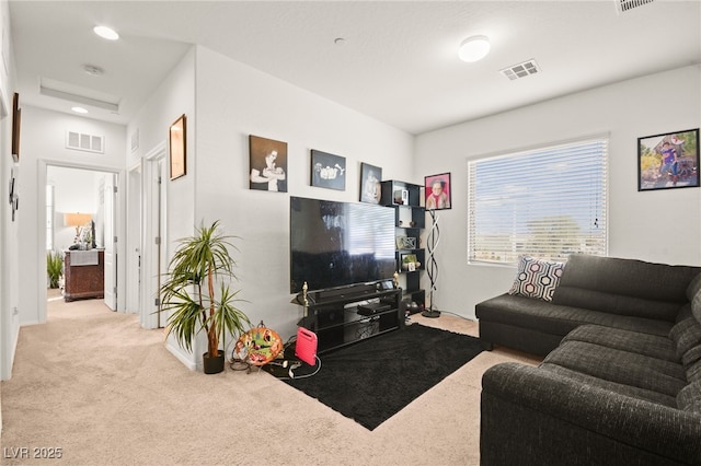 living room with carpet and visible vents