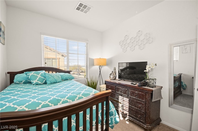 bedroom with visible vents, carpet flooring, and baseboards