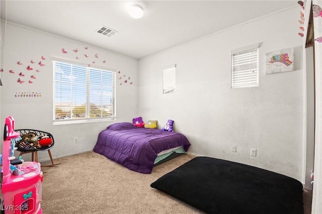 bedroom with visible vents and carpet flooring