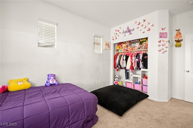 carpeted bedroom featuring a closet and ornamental molding