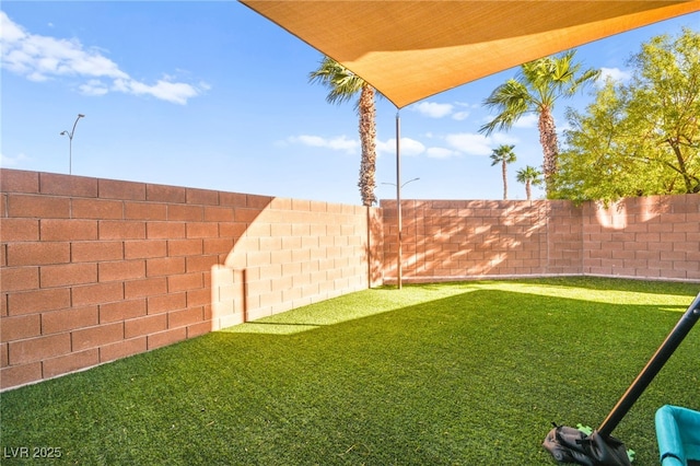 view of yard featuring a fenced backyard