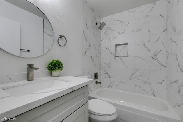 bathroom with vanity, shower / bathing tub combination, and toilet