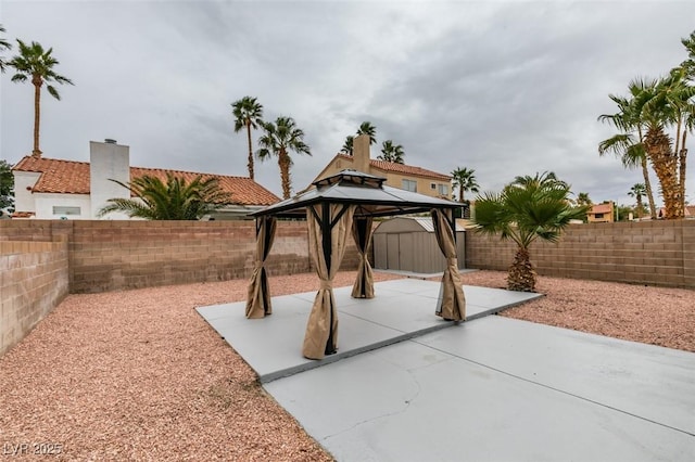 view of patio / terrace with a gazebo and a fenced backyard