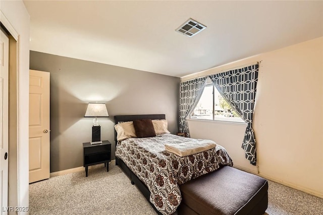 bedroom featuring visible vents, light carpet, and baseboards