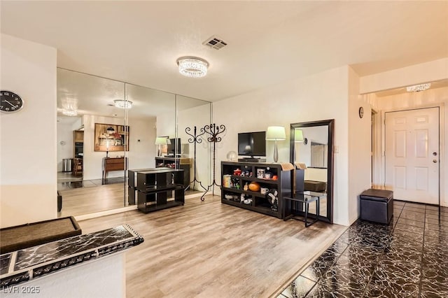 kitchen featuring visible vents and wood finished floors