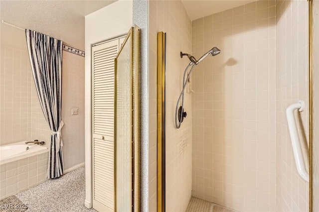 full bathroom with a shower stall and a garden tub