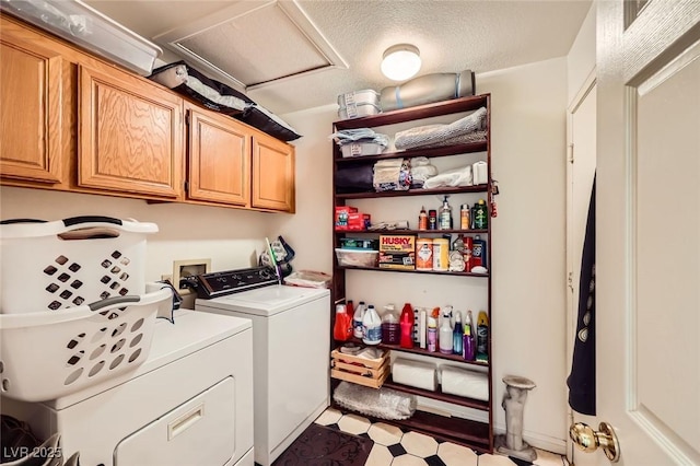 2611 Laguna Shores Ln, Las Vegas, NV 89121 - clothes washing area with a textured ceiling, cabinet space, separate washer and dryer, light floors, and attic access
