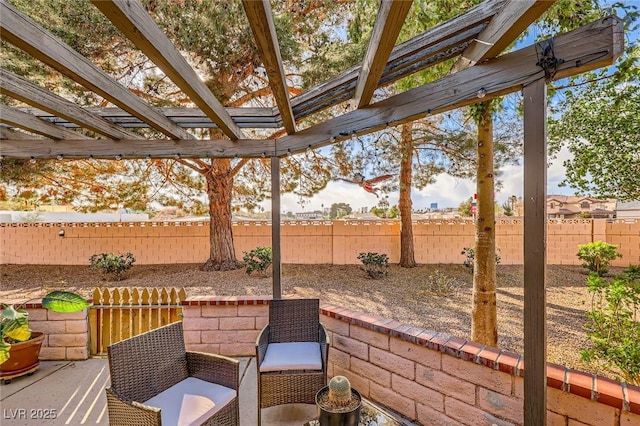 view of patio / terrace featuring a fenced backyard and a pergola