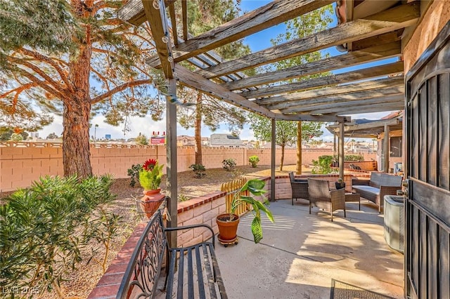 view of patio / terrace featuring a pergola and a fenced backyard