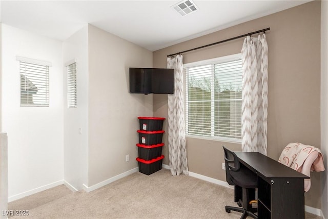 home office with visible vents, baseboards, and carpet