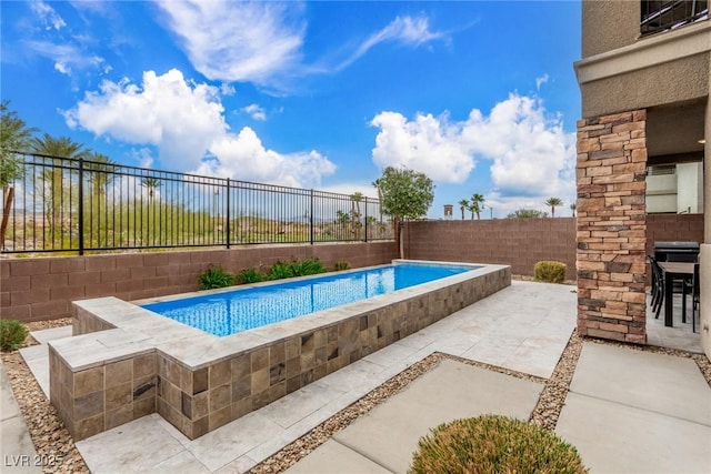 view of pool with a patio, a fenced backyard, and a fenced in pool