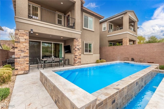 view of pool featuring a fenced in pool, a patio, and a fenced backyard