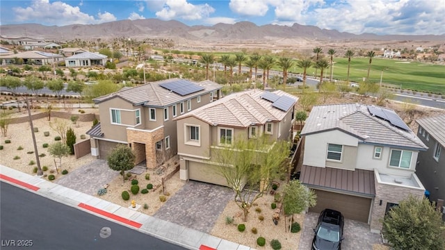 drone / aerial view with a residential view and a mountain view