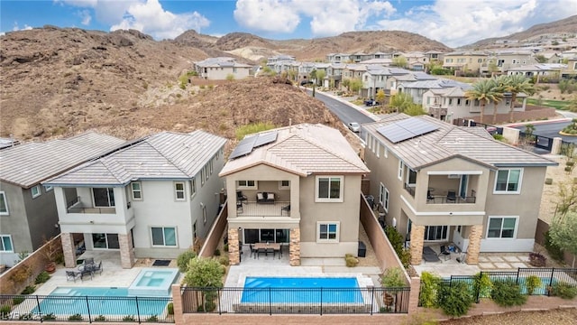 birds eye view of property with a residential view and a mountain view