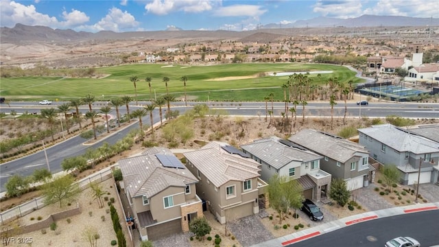 birds eye view of property featuring a residential view, a mountain view, and view of golf course