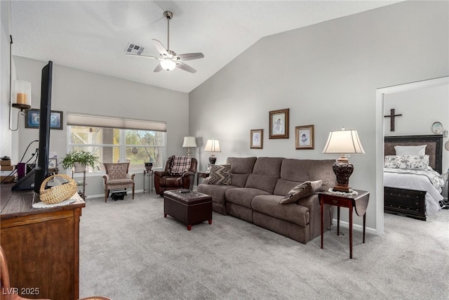 carpeted living room with visible vents, baseboards, high vaulted ceiling, and a ceiling fan