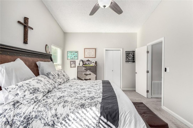 bedroom featuring visible vents, baseboards, carpet, and a textured ceiling