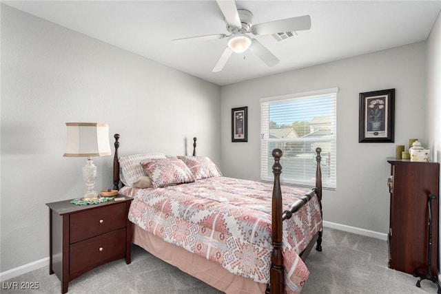 carpeted bedroom featuring baseboards, visible vents, and ceiling fan