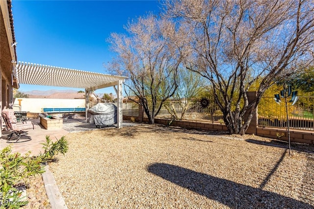 view of yard with a patio area, a pergola, and a fenced backyard