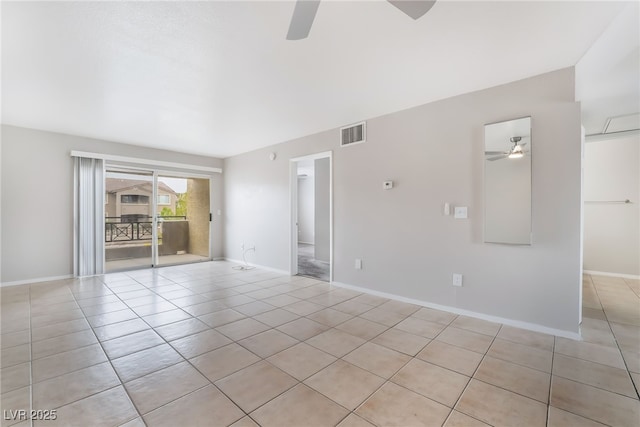 spare room with visible vents, baseboards, ceiling fan, and light tile patterned flooring