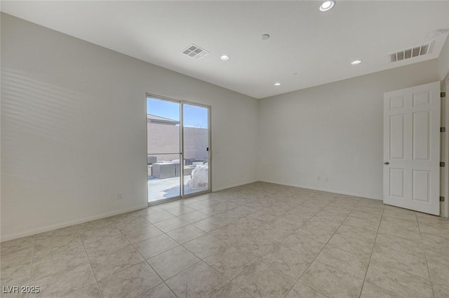 empty room with light tile patterned flooring, visible vents, recessed lighting, and baseboards