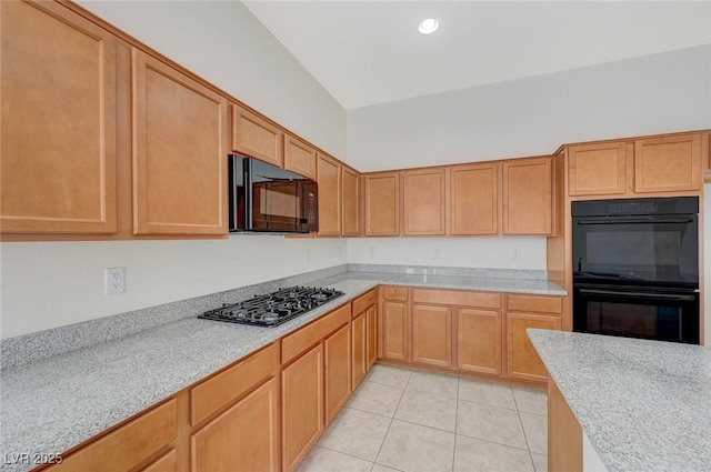 kitchen with light tile patterned flooring, recessed lighting, black appliances, and light countertops