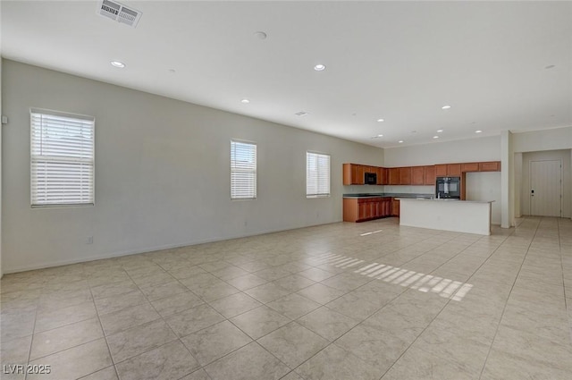 unfurnished living room featuring recessed lighting, visible vents, baseboards, and light tile patterned flooring