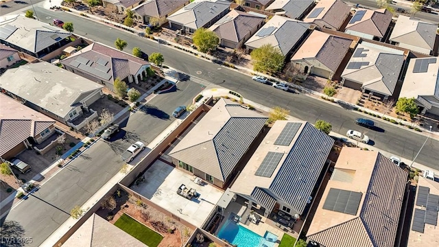 birds eye view of property with a residential view