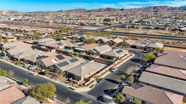 birds eye view of property with a mountain view and a residential view