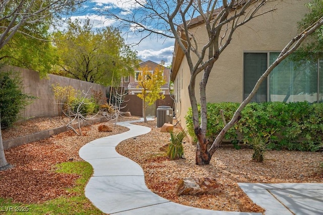 view of yard featuring central air condition unit and a fenced backyard