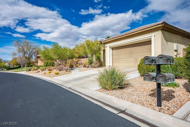 garage with concrete driveway