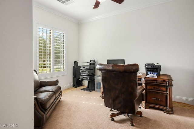 home office with a ceiling fan, baseboards, visible vents, crown molding, and carpet flooring