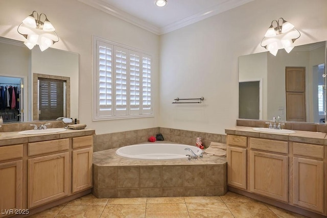 bathroom featuring a sink, a garden tub, crown molding, and tile patterned flooring