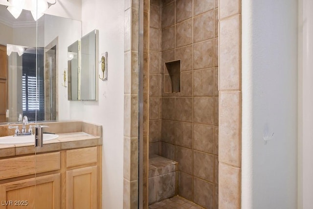 full bath with vanity and a shower stall