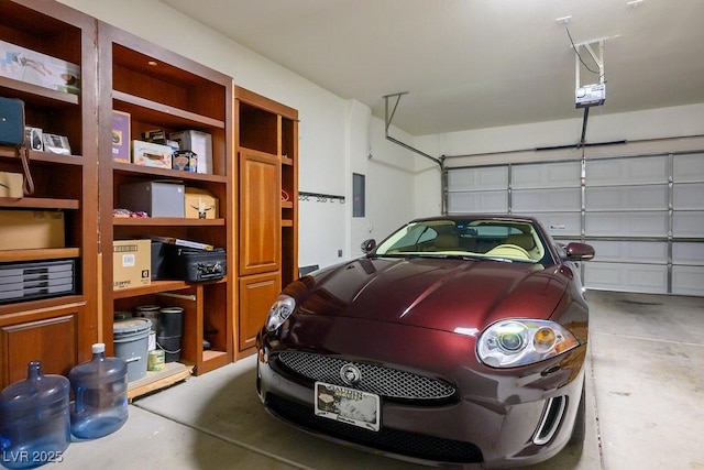 garage featuring electric panel and a garage door opener